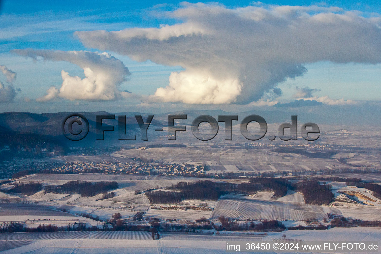 Wintry snowy townscape with streets and houses of the residential areas in Klingenmuenster in the state Rhineland-Palatinate