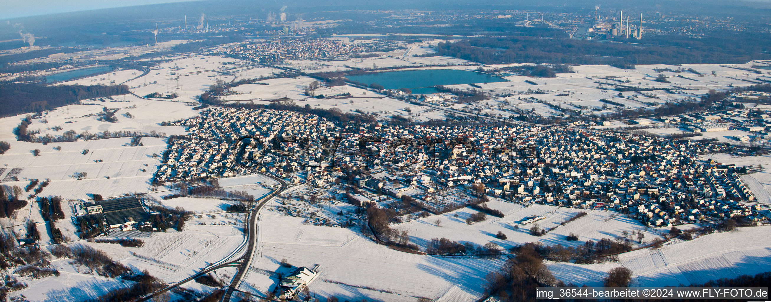 Wintry snowy Panoramic perspective Town View of the streets and houses of the residential areas in Hagenbach in the state Rhineland-Palatinate, Germany
