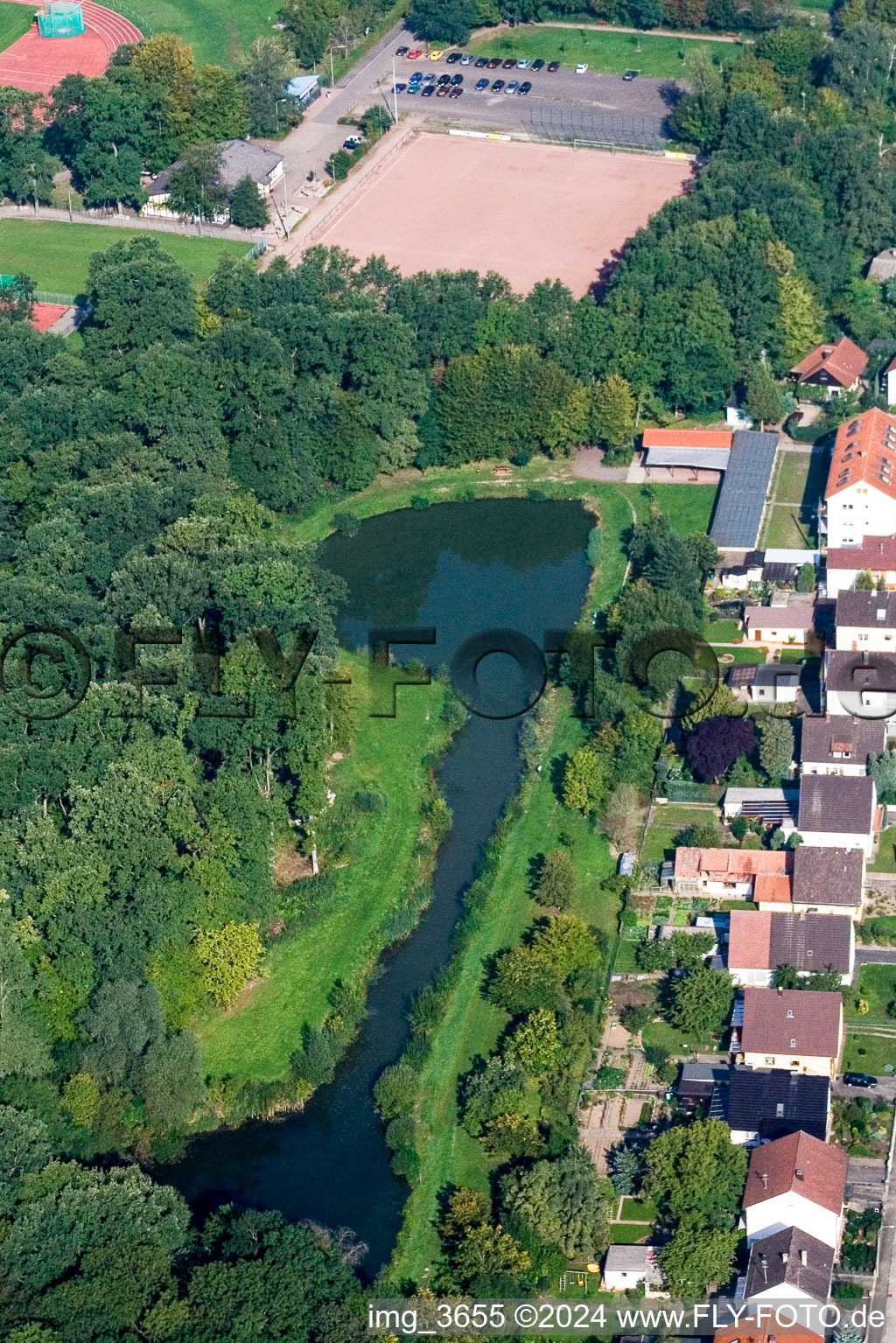 Riparian areas on the lake area of Polizeiweier with Angelvereinsgelaende in Kandel in the state Rhineland-Palatinate