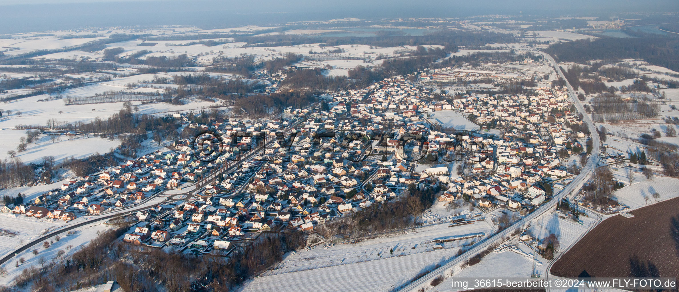 Aerial view of Wintry snowy Town View of the streets and houses of the residential areas in Mothern in Grand Est, France