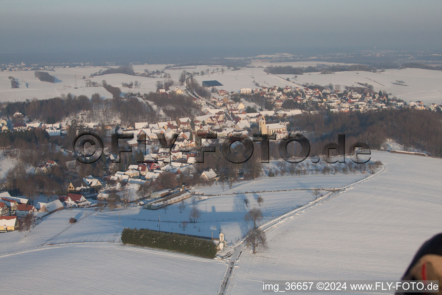 In winter when there is snow in Neewiller-près-Lauterbourg in the state Bas-Rhin, France seen from above