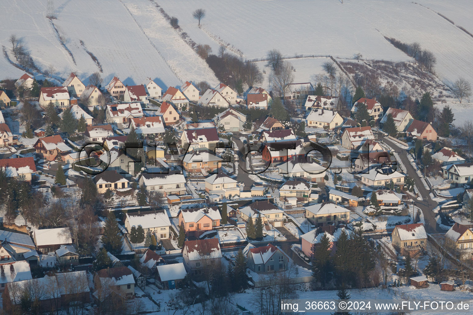 In winter when there is snow in Neewiller-près-Lauterbourg in the state Bas-Rhin, France from the drone perspective