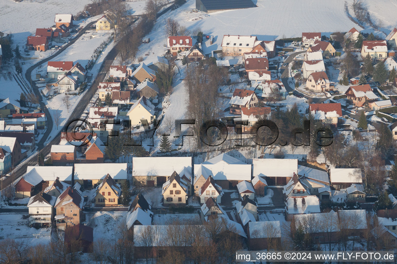 In winter when there is snow in Neewiller-près-Lauterbourg in the state Bas-Rhin, France seen from a drone