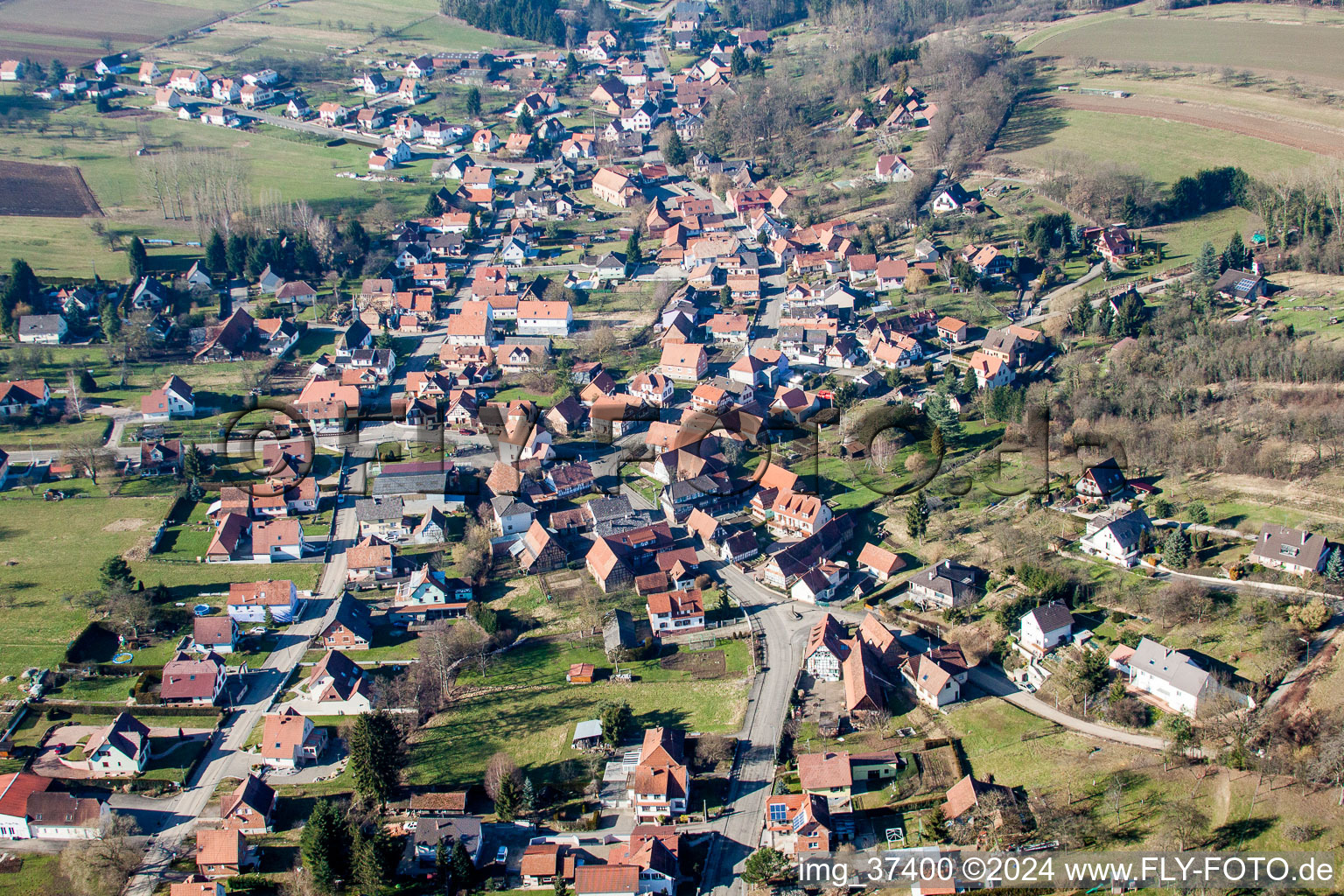 Aerial view of Village - view on the edge of agricultural fields and farmland in Lobsann in Grand Est, France