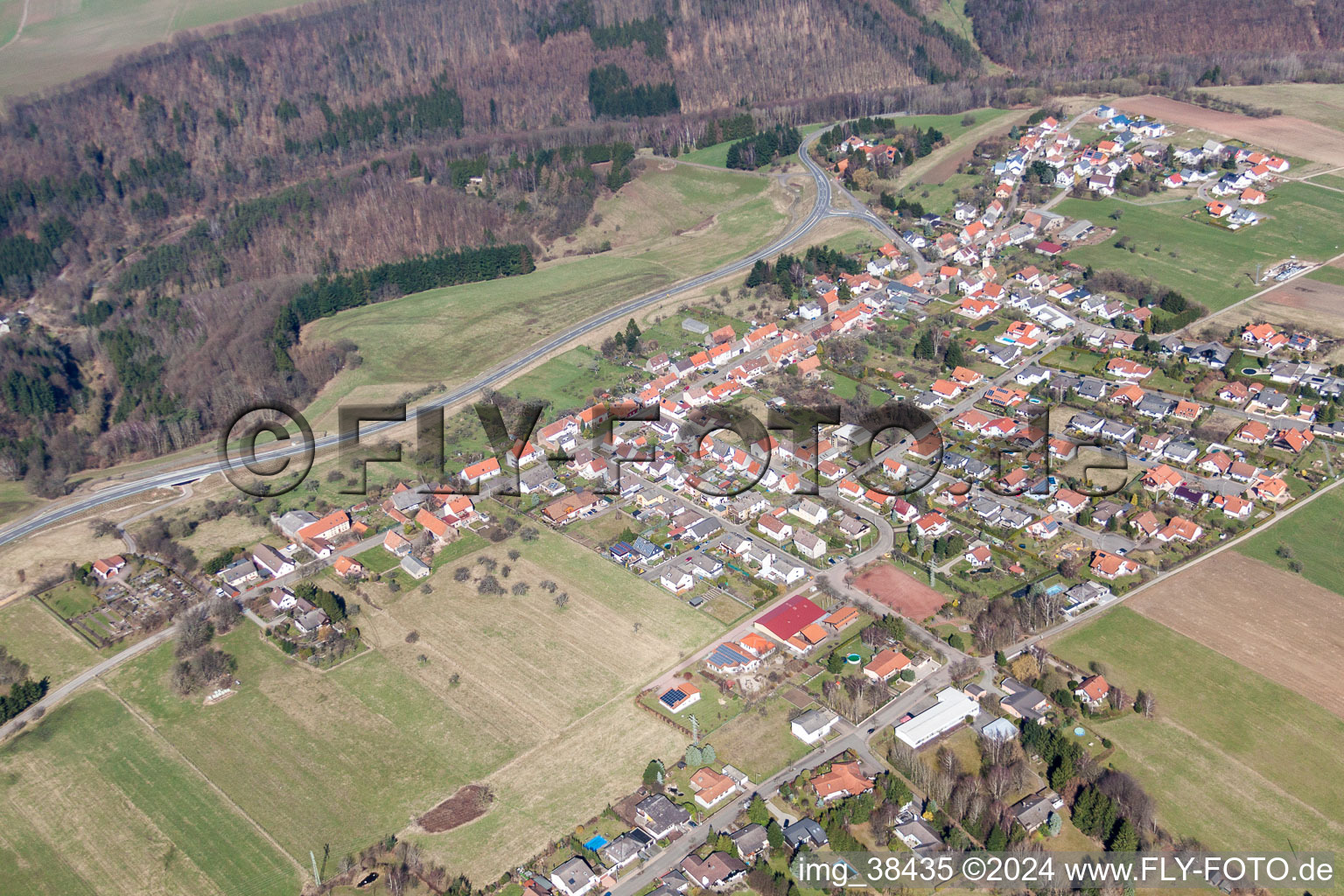 Village - view on the edge of agricultural fields and farmland in Obersimten in the state Rhineland-Palatinate, Germany
