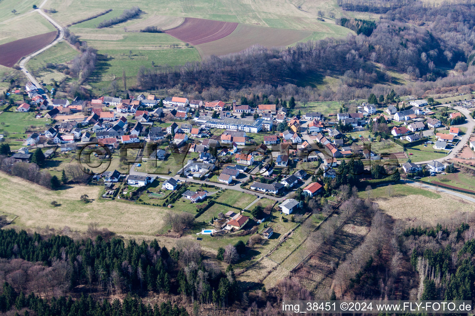 Aerial photograpy of Village - view on the edge of agricultural fields and farmland in Schweix in the state Rhineland-Palatinate, Germany