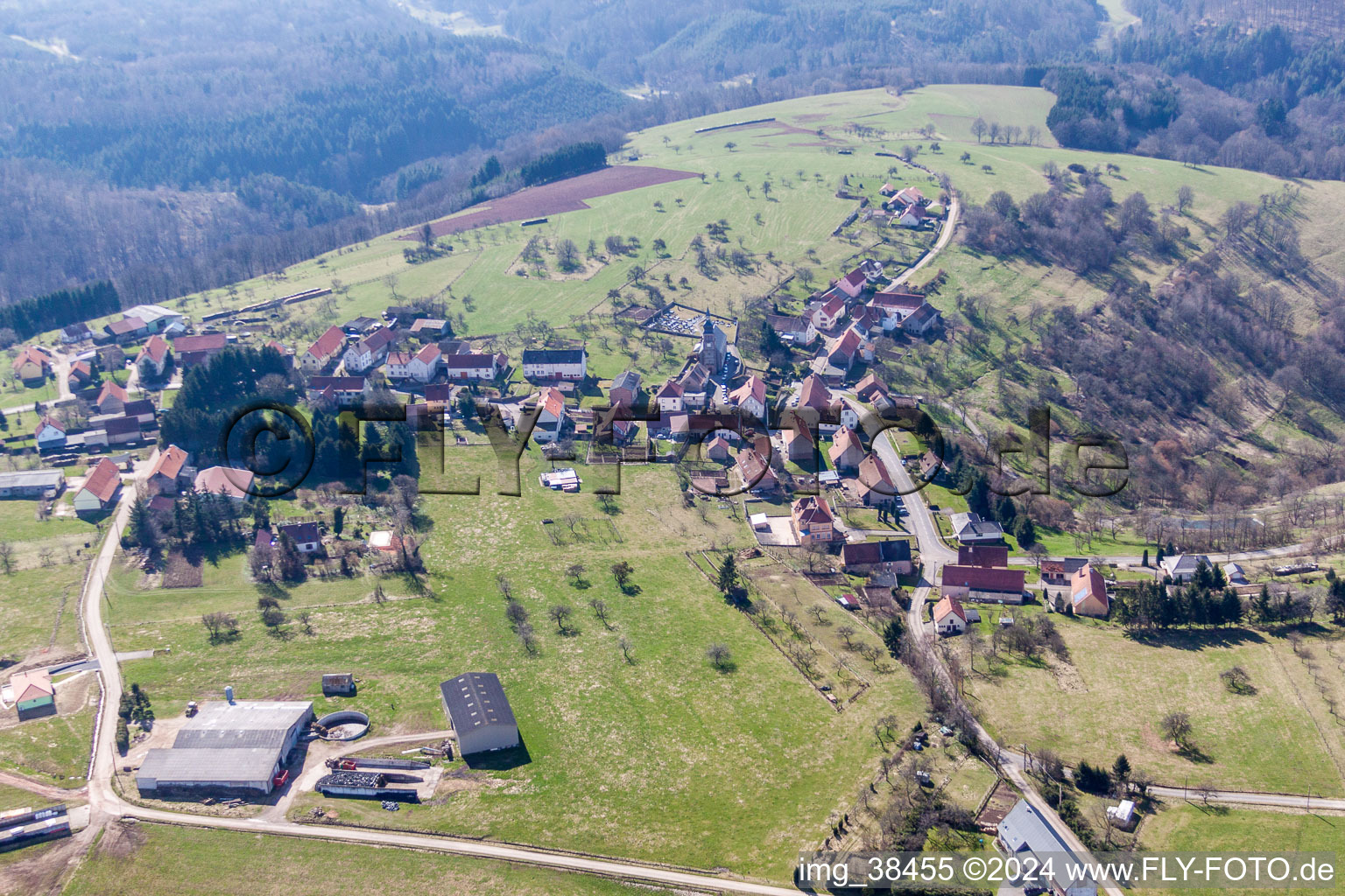 Aerial photograpy of Village - view on the edge of agricultural fields and farmland in Liederschiedt in Grand Est, France