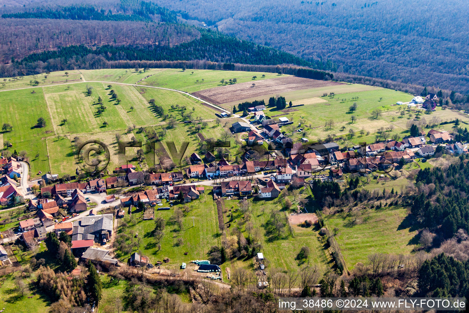 Village - view on the edge of agricultural fields and farmland in Ratzwiller in Grand Est, France