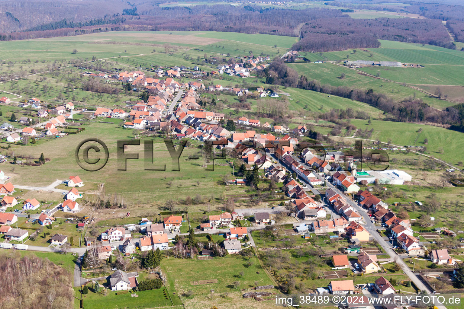 Village - view on the edge of agricultural fields and farmland in Weislingen in Grand Est, France