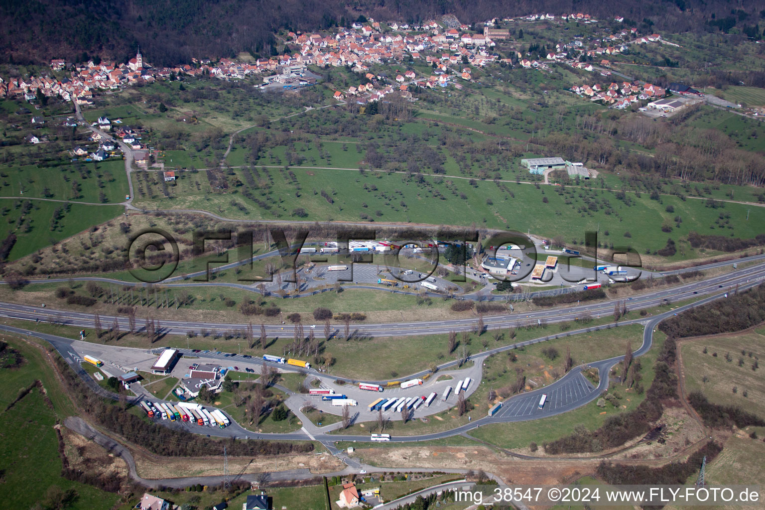 Aerial view of Motorway service area on the edge of the course of A4 highway Aire de Service AVIA de Saverne-Eckartswiller in Eckartswiller in Grand Est, France