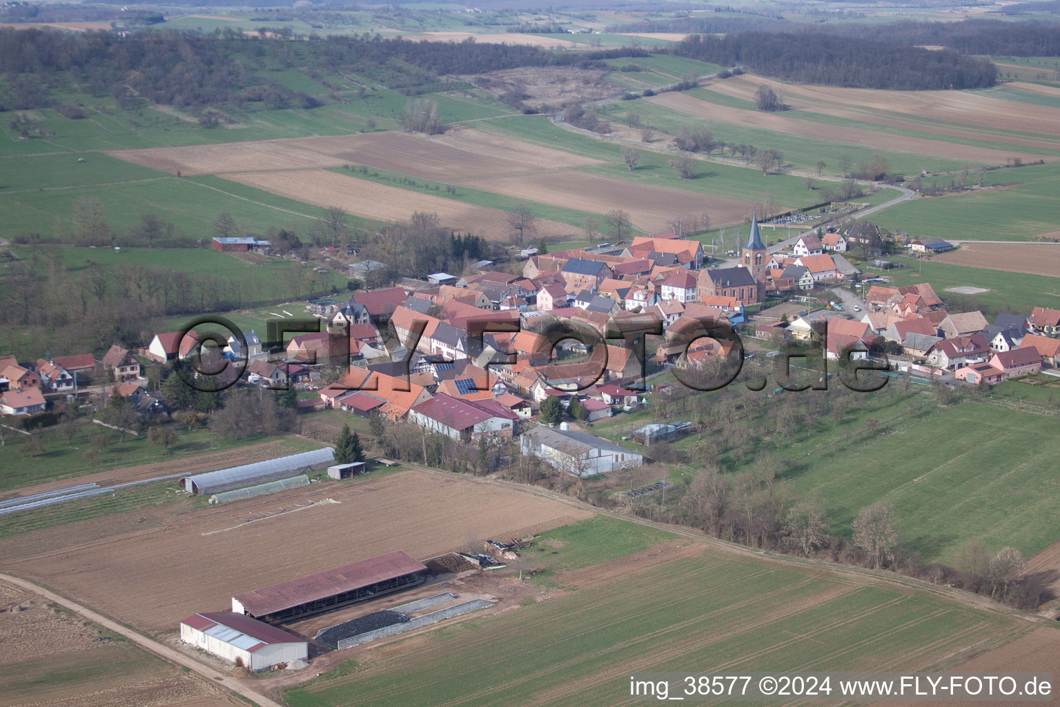 Village - view on the edge of agricultural fields and farmland in Geiswiller in Grand Est, France