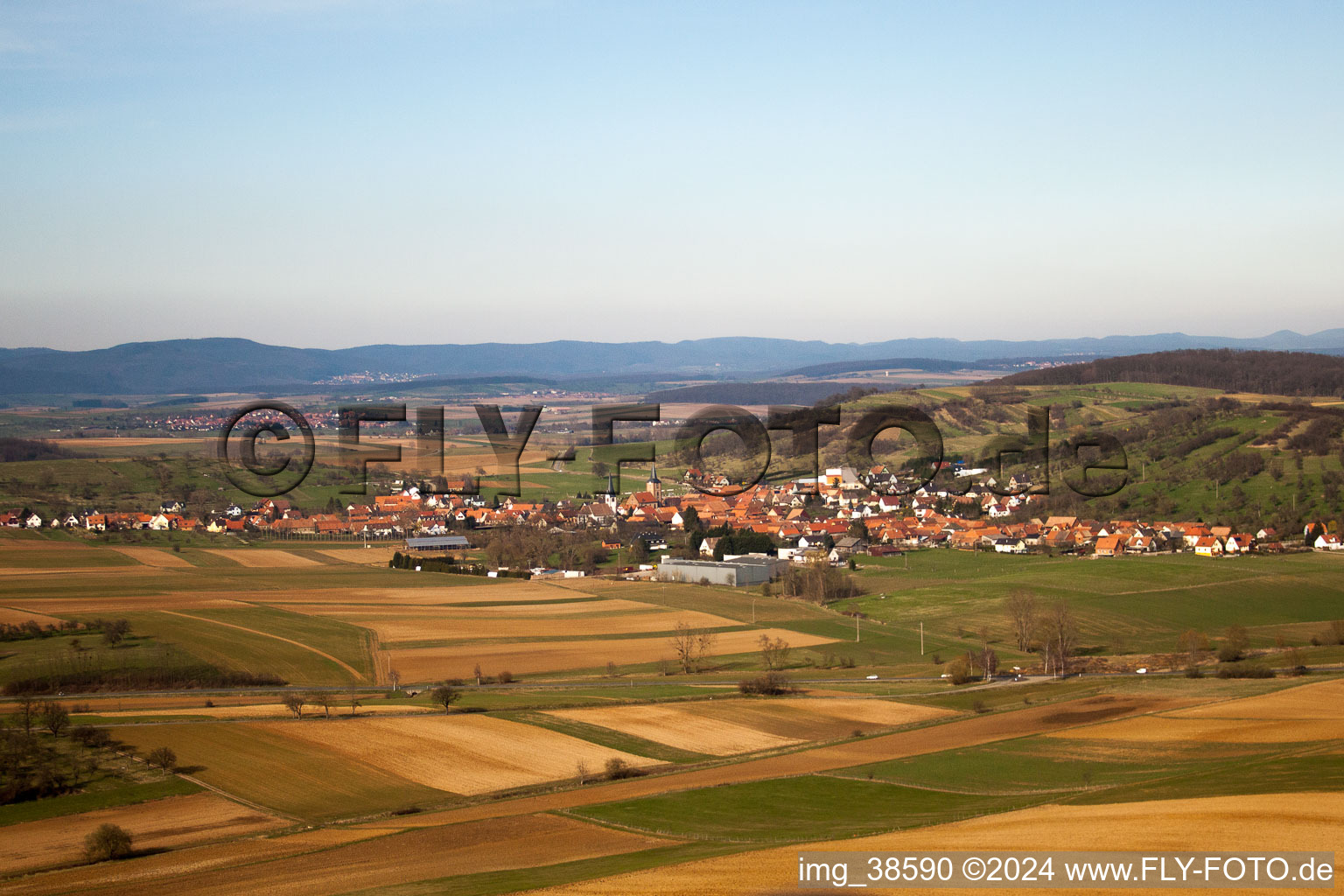 Village - view on the edge of agricultural fields and farmland in Kirrwiller in Grand Est, France