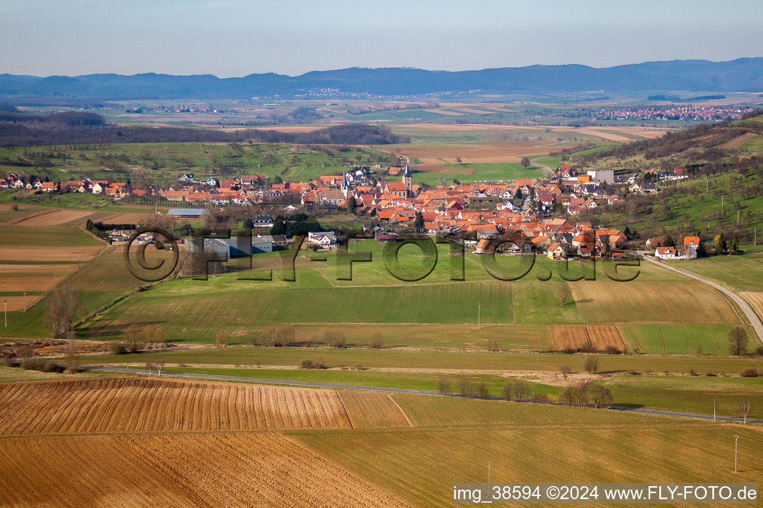 Aerial view of Village - view on the edge of agricultural fields and farmland in Kirrwiller in Grand Est, France