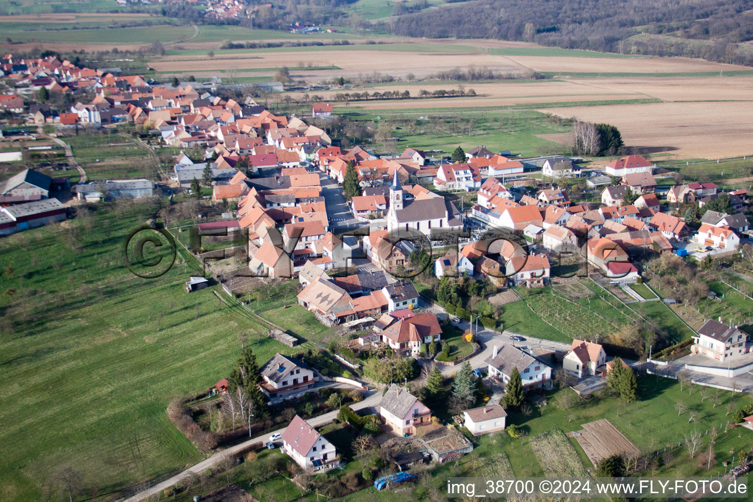 Village - view on the edge of agricultural fields and farmland in Forstheim in Grand Est, France