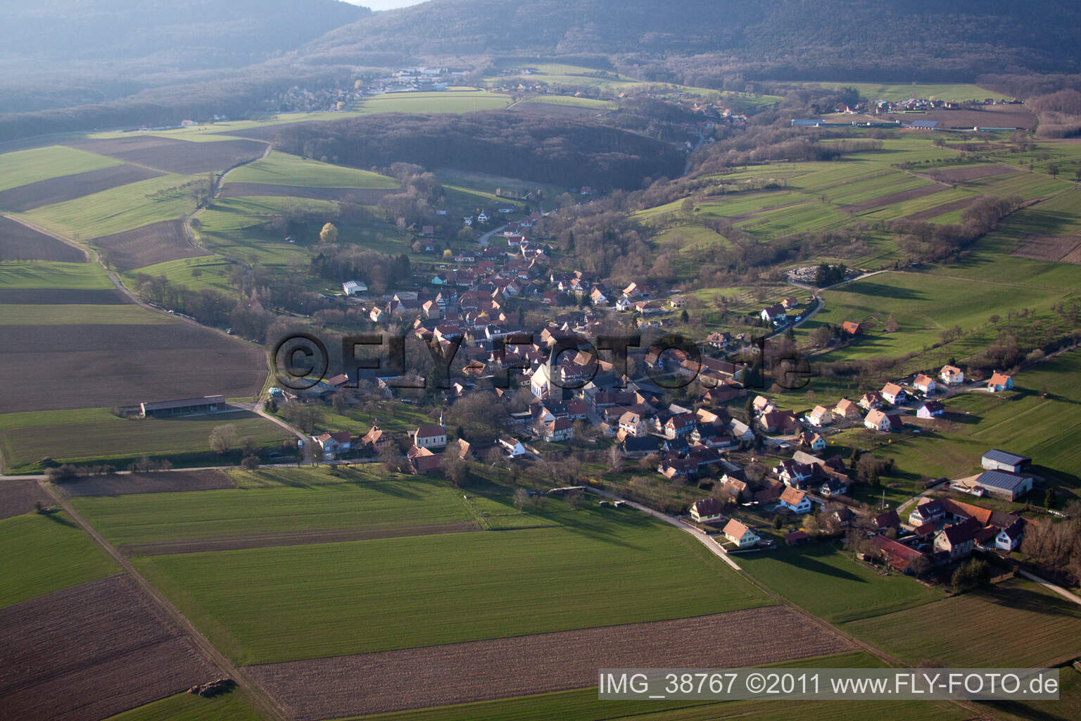 Aerial view of Village - view on the edge of agricultural fields and farmland in Drachenbronn-Birlenbach in Grand Est, France