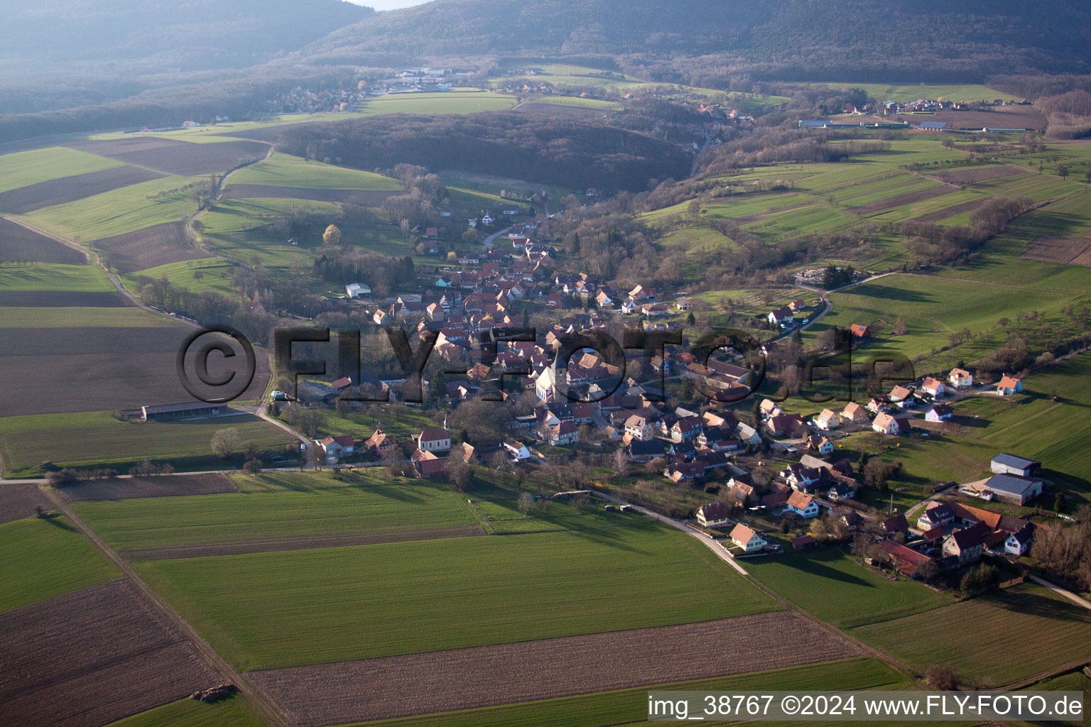 Aerial view of Village - view on the edge of agricultural fields and farmland in Drachenbronn-Birlenbach in Grand Est, France