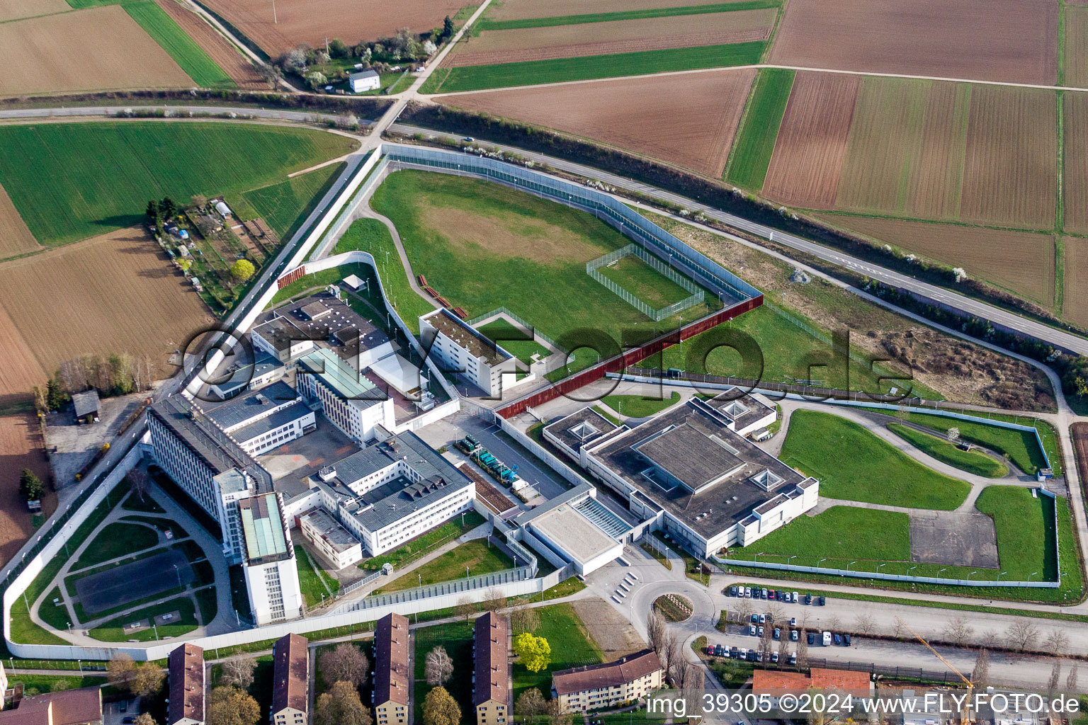 Aerial view of Prison grounds and high security fence Prison Justizvollzugsanstalt Stuttgart in Stammheim in the state Baden-Wurttemberg, Germany