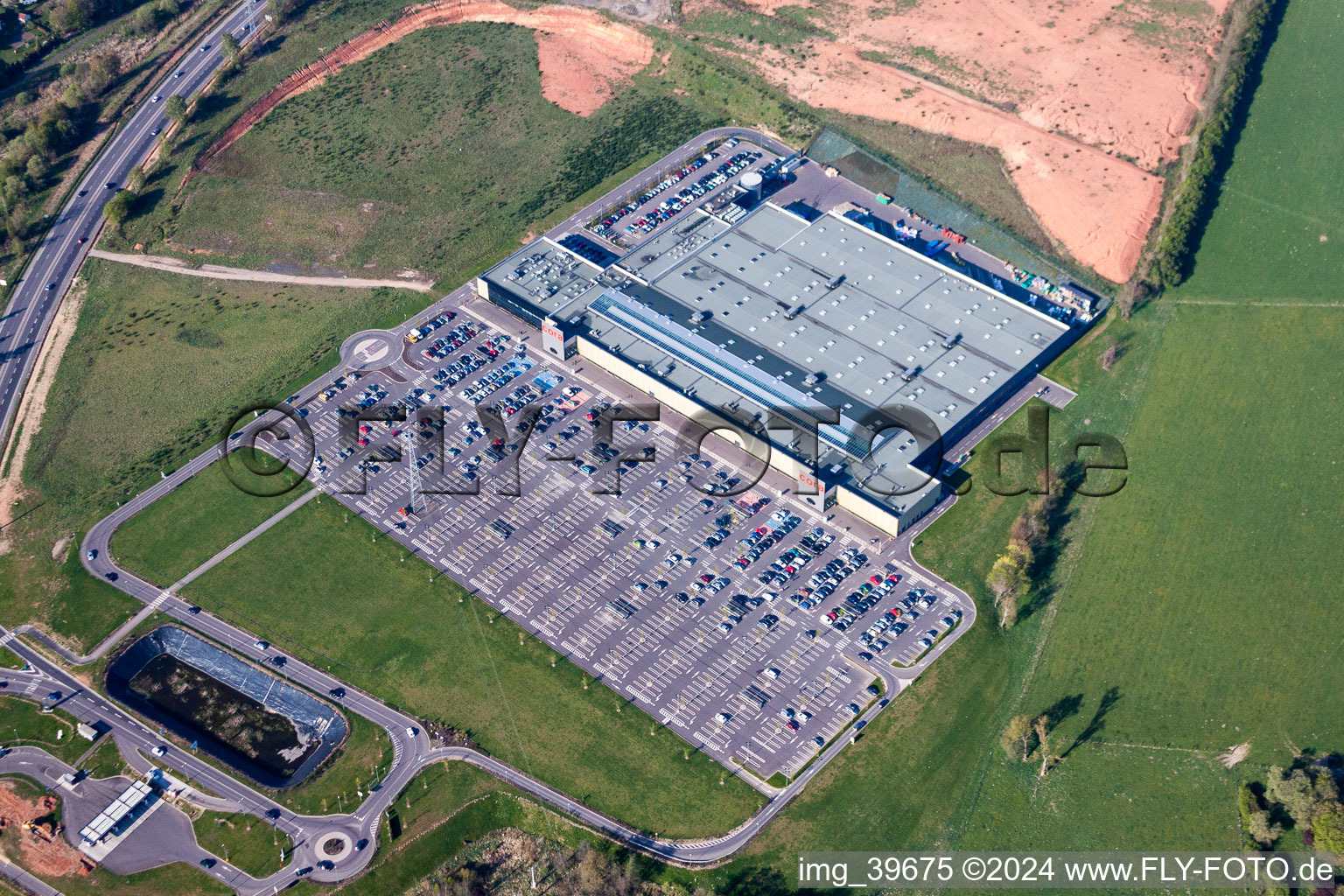 Building of the shopping center Cora in Longeville-les-Saint-Avold in Grand Est, France