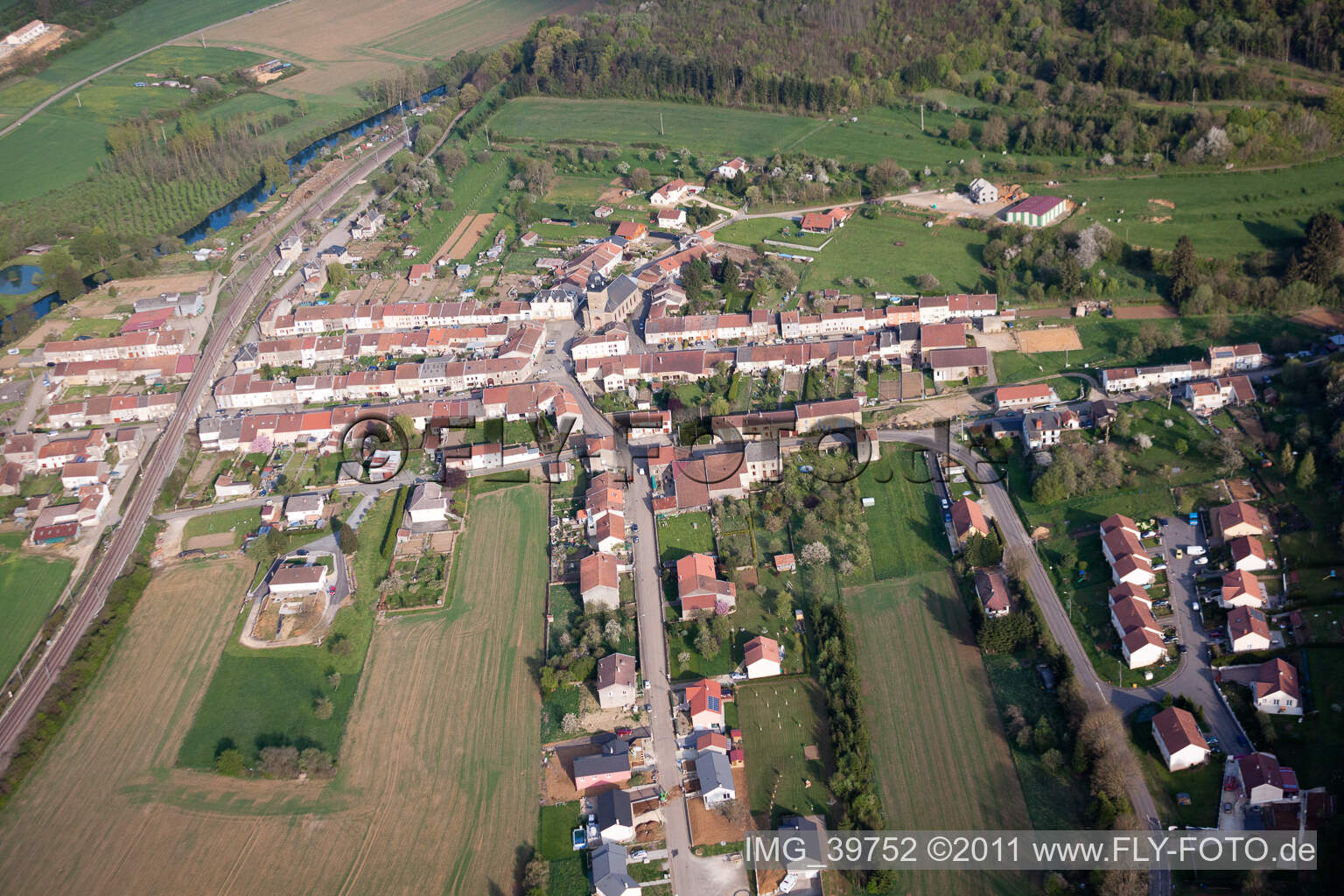 Village - view on the edge of agricultural fields and farmland in Charency-Vezin in Grand Est, France