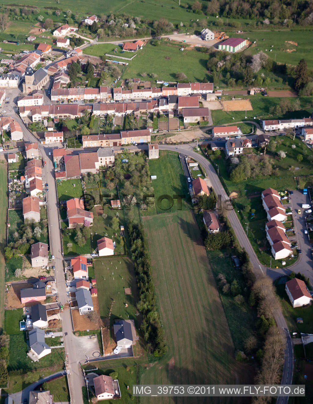 Aerial photograpy of Village - view on the edge of agricultural fields and farmland in Charency-Vezin in Grand Est, France