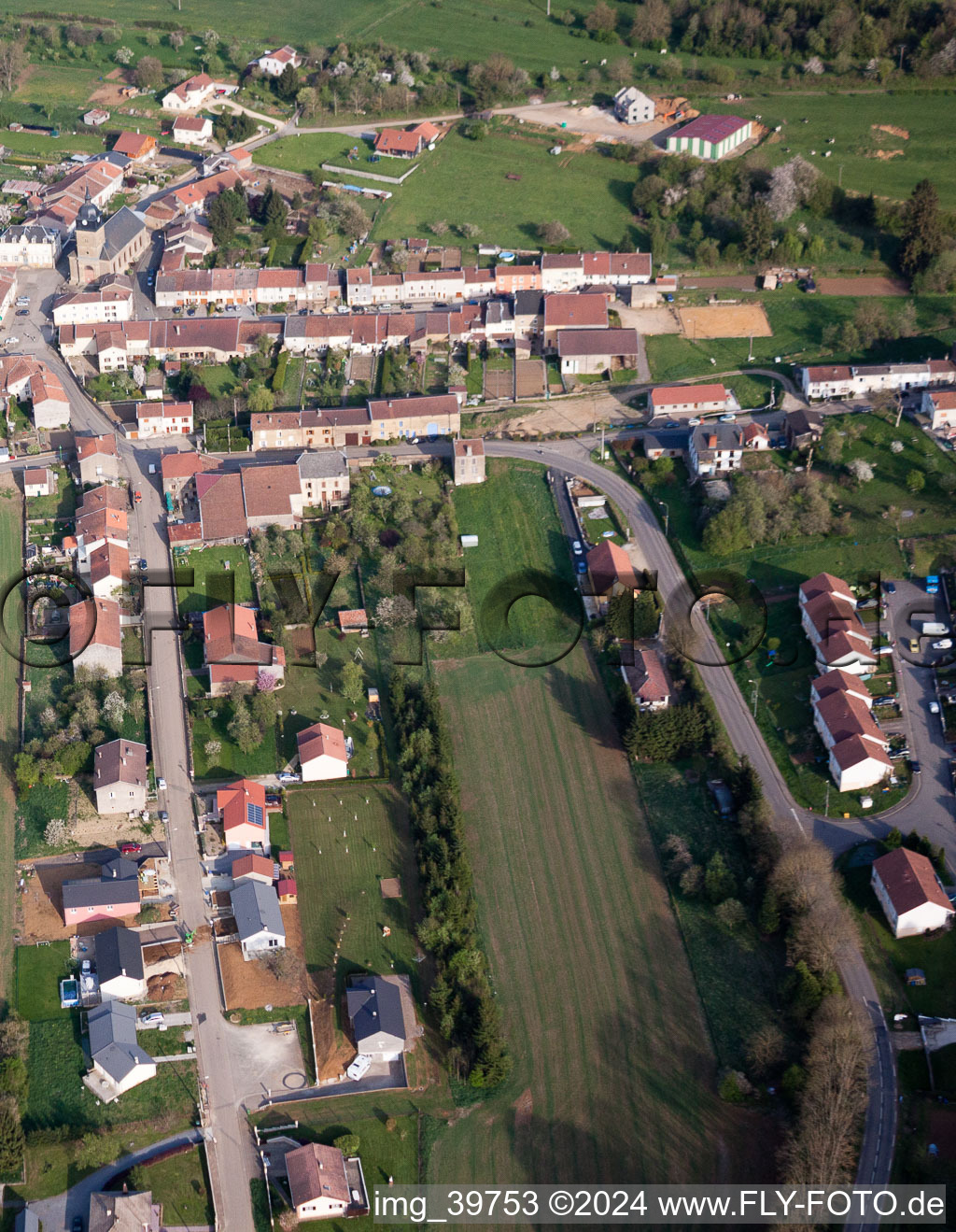 Aerial photograpy of Village - view on the edge of agricultural fields and farmland in Charency-Vezin in Grand Est, France