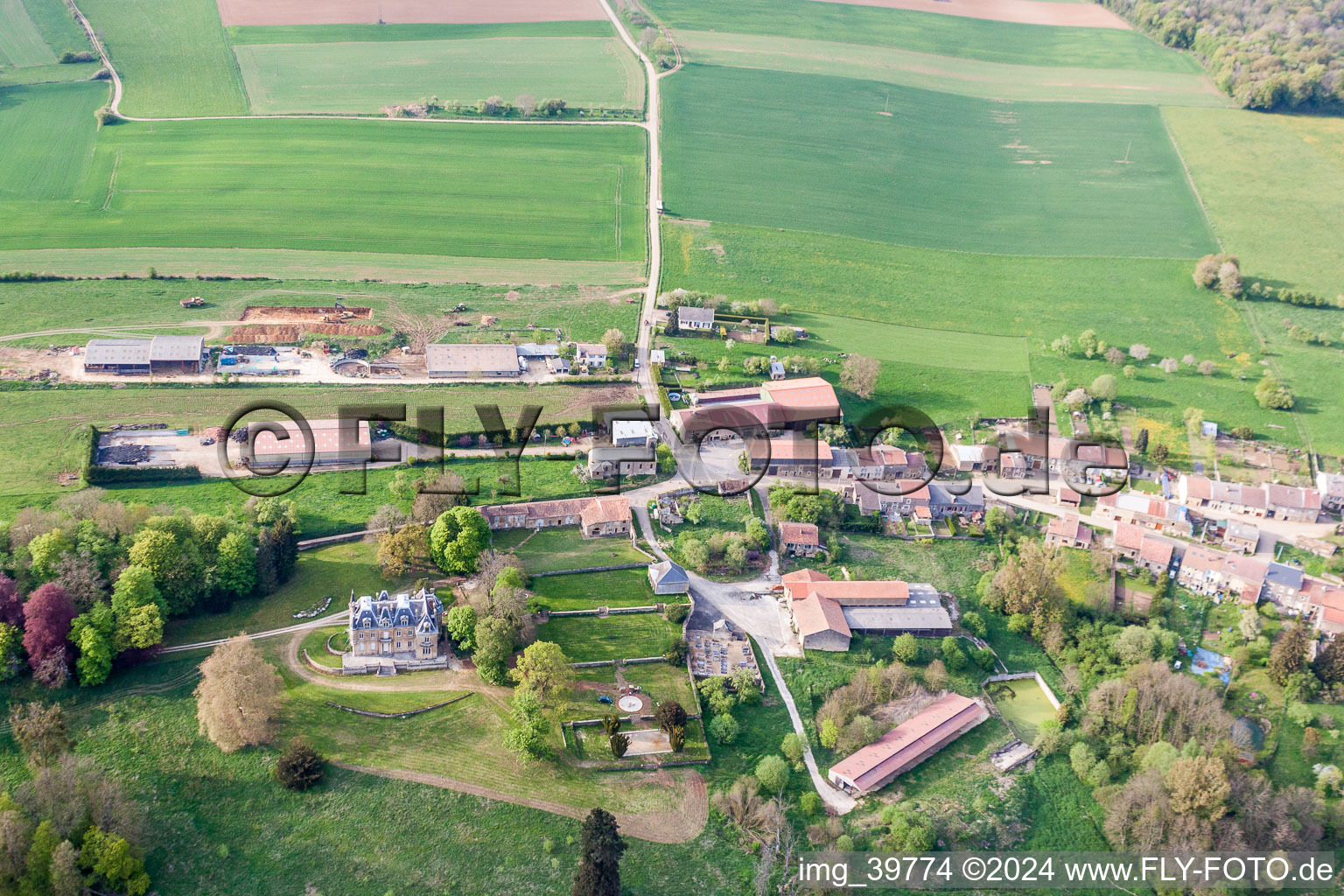 Village - view on the edge of agricultural fields and farmland in Fresnois in Grand Est, France
