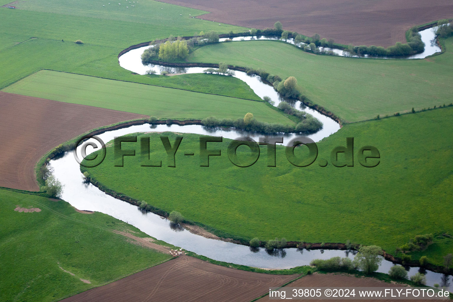 Aerial view of Curved loop of the riparian zones on the course of the river La Chiers in Carignan in Alsace-Champagne-Ardenne-Lorraine, France