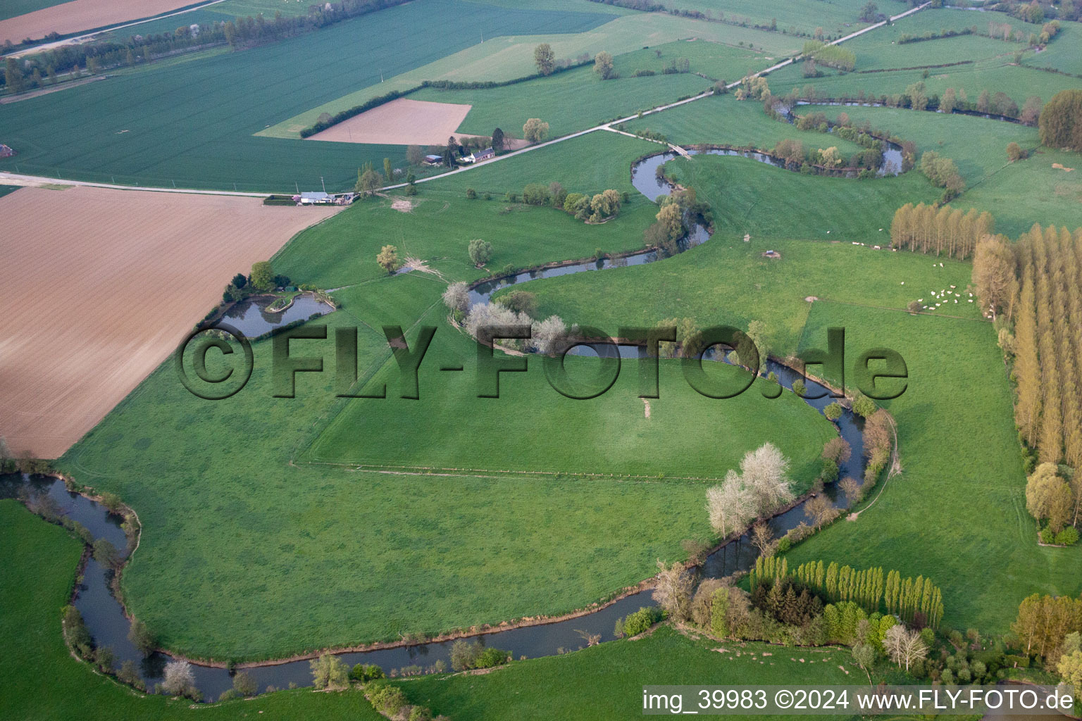Aerial view of Curved loop of the riparian zones on the course of the river Oise in Chigny in Hauts-de-France, France