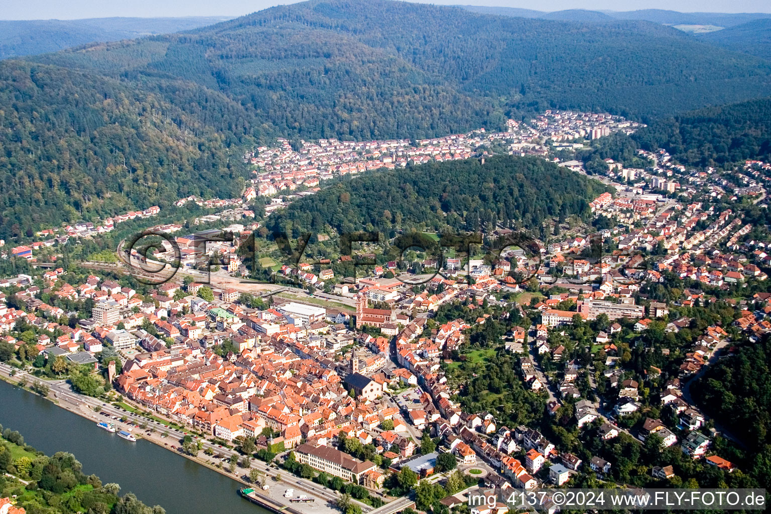 Oblique view of Village on the banks of the area Neckar - river course in Eberbach in the state Baden-Wurttemberg