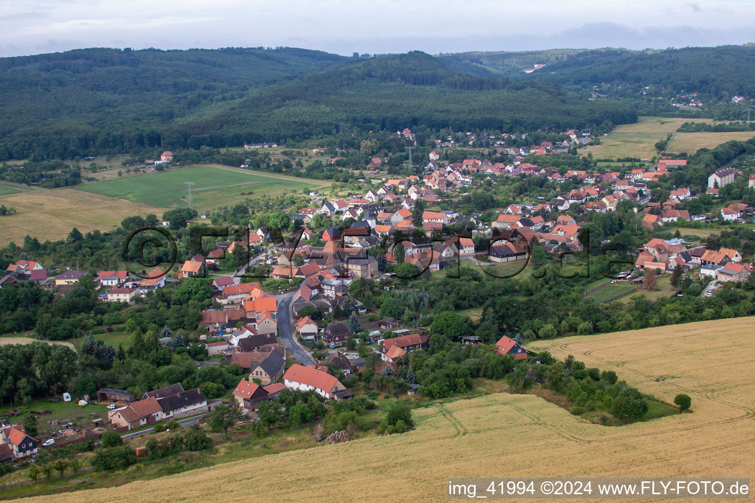Village - view on the edge of agricultural fields and farmland in Wienrode in the state Saxony-Anhalt, Germany