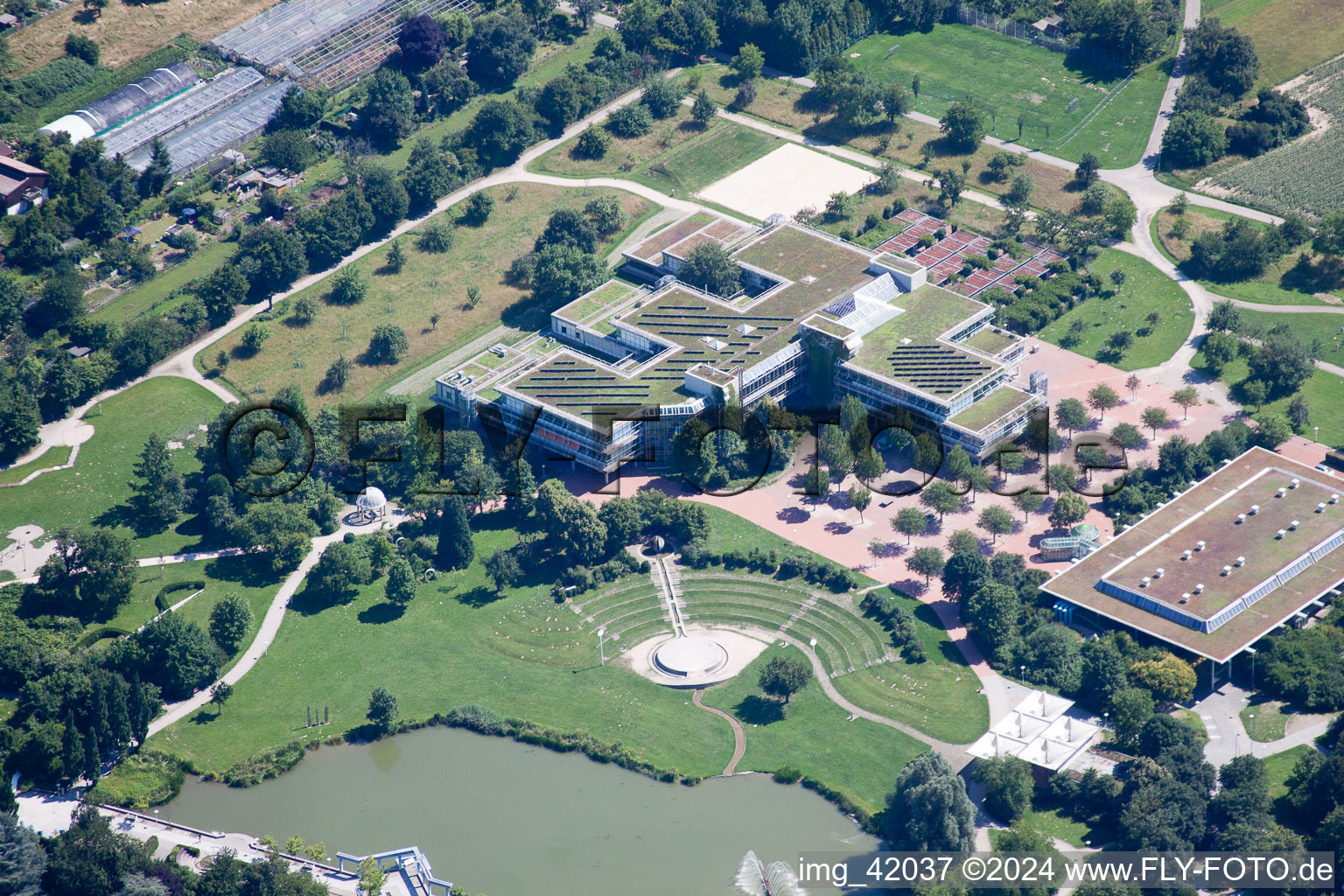 Park of Horbachpark with lake Hoebach , Anne-Frank school and Albgauhalle in Ettlingen in the state Baden-Wurttemberg