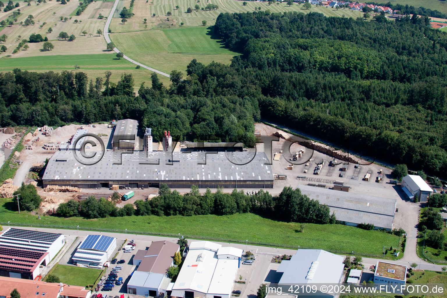 Oblique view of Building and production halls on the premises of corthum Nordschwarzwald GmbH - corthum Erdenwerk in the district Pfaffenrot in Marxzell in the state Baden-Wurttemberg