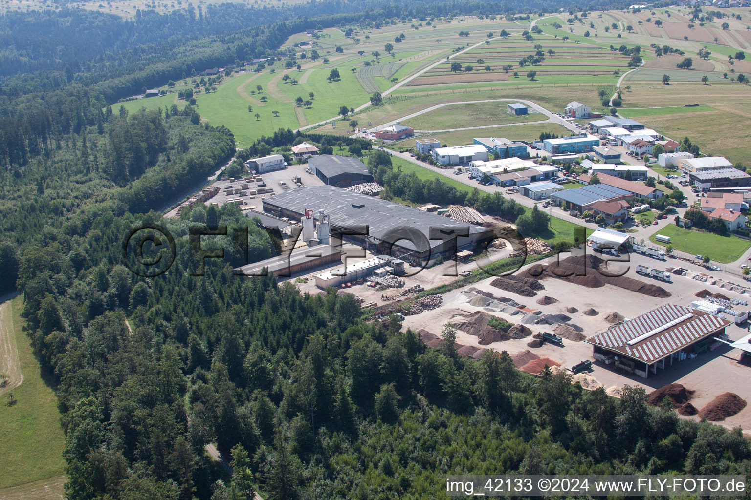 Building and production halls on the premises of corthum Nordschwarzwald GmbH - corthum Erdenwerk in the district Pfaffenrot in Marxzell in the state Baden-Wurttemberg from above