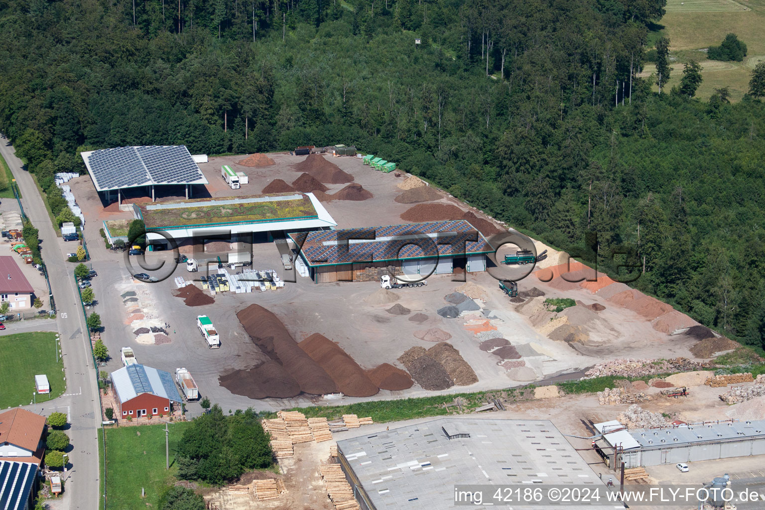 Building and production halls on the premises of corthum Nordschwarzwald GmbH - corthum Erdenwerk in the district Pfaffenrot in Marxzell in the state Baden-Wurttemberg seen from above