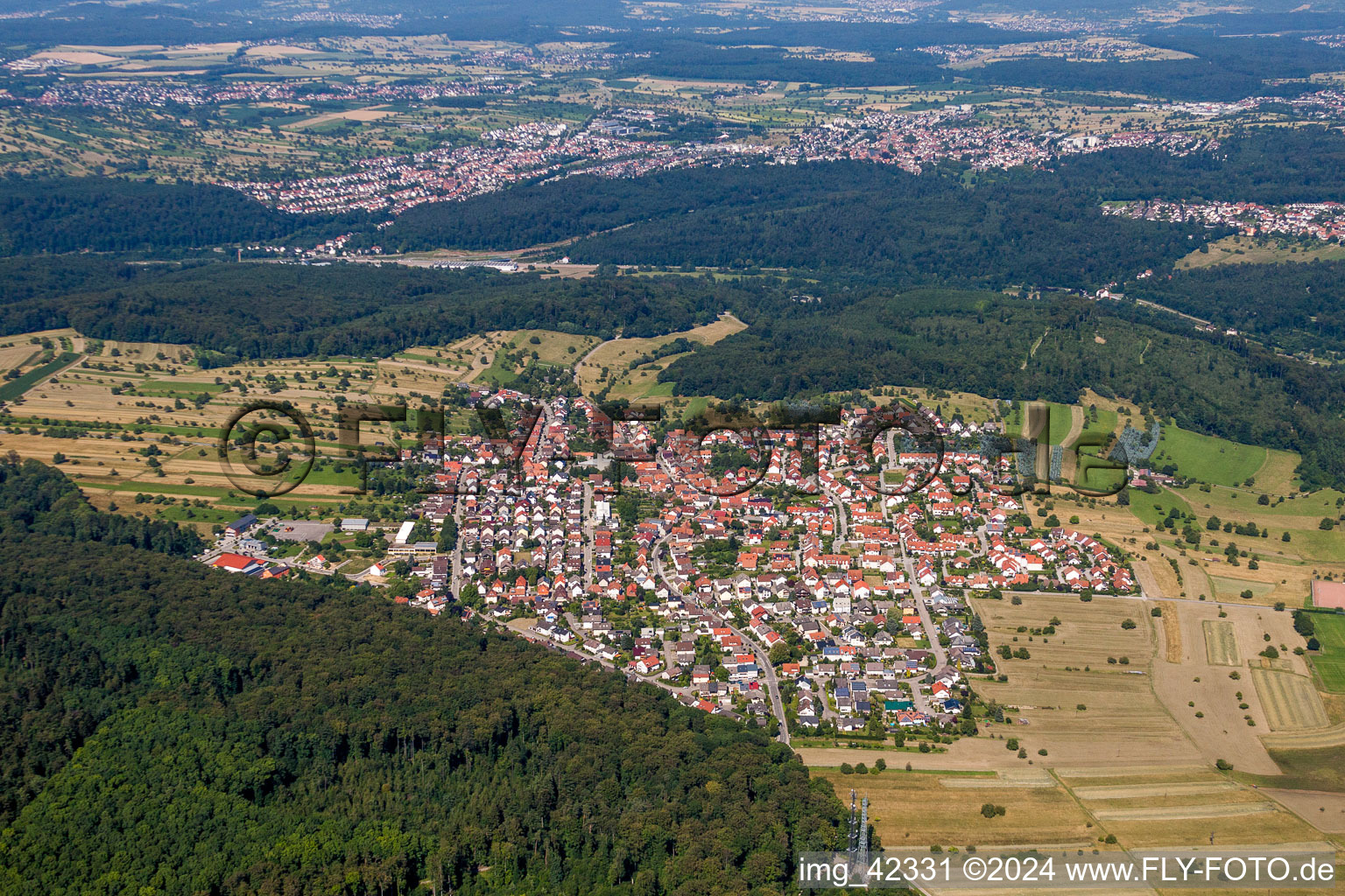 Village - view on the edge of agricultural fields and farmland in Spessart in the state Baden-Wurttemberg, Germany