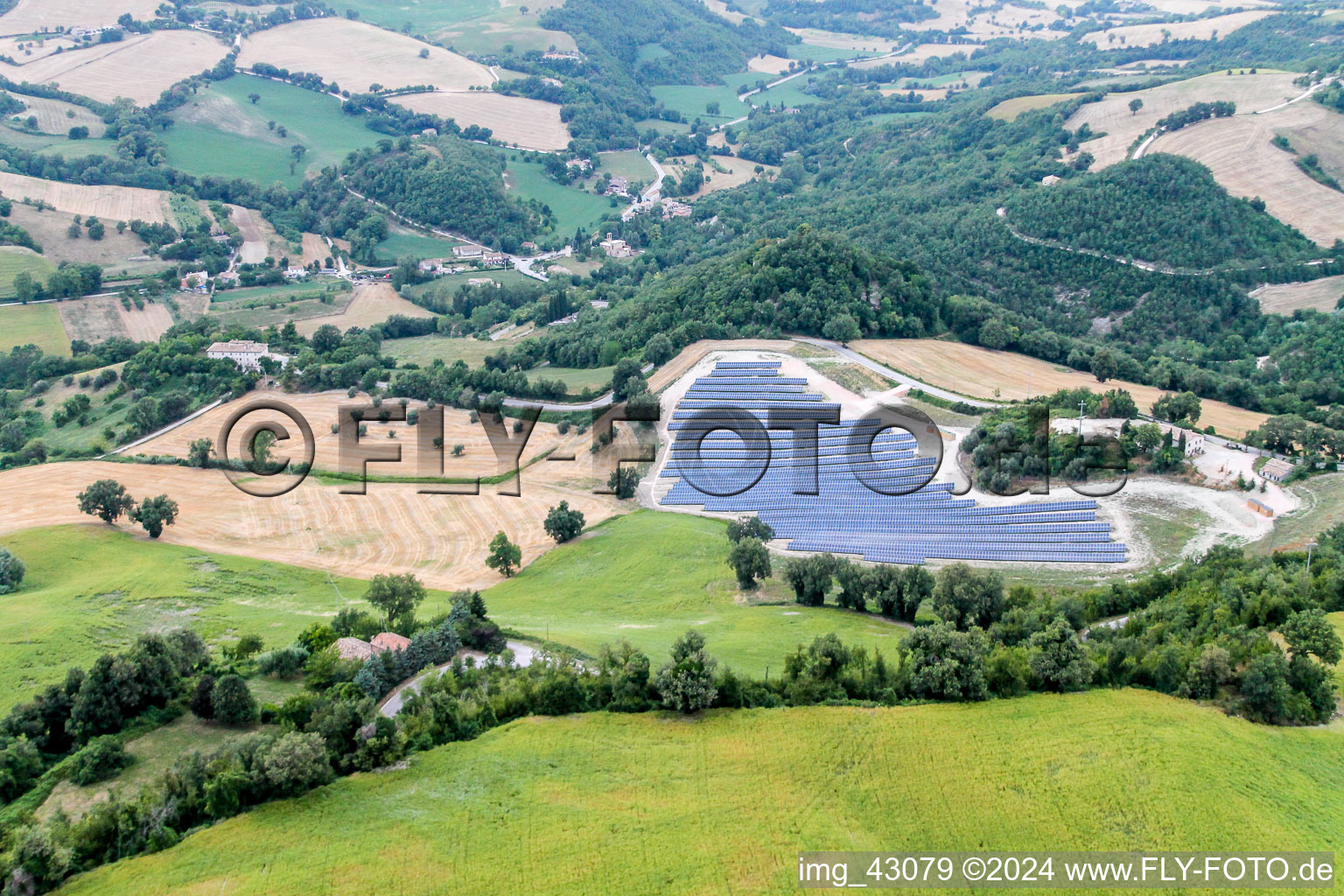 Panel rows of photovoltaic and solar farm in Cartoceto in Marche, Italy