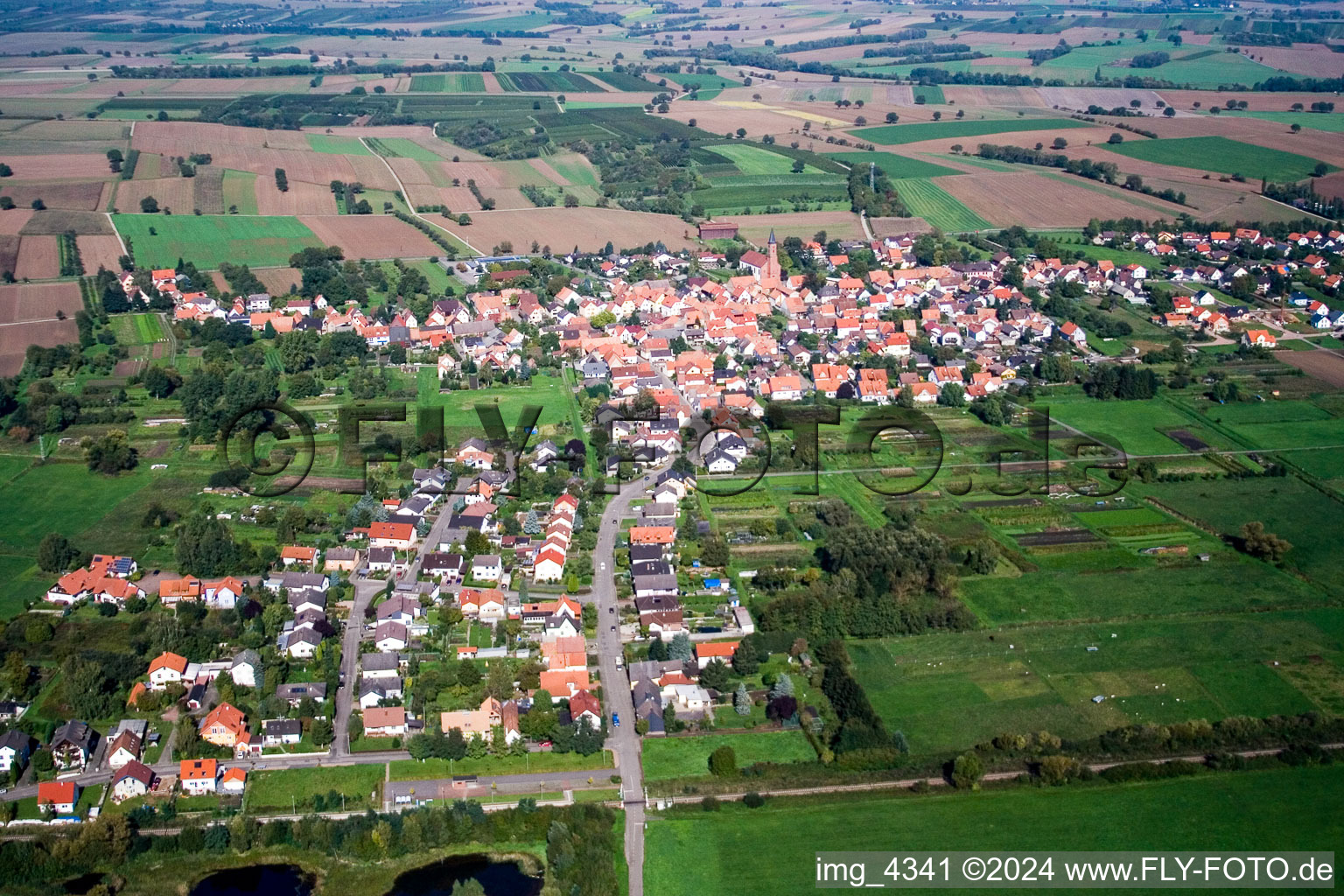 Village - view on the edge of agricultural fields and farmland in Kapsweyer in the state Rhineland-Palatinate