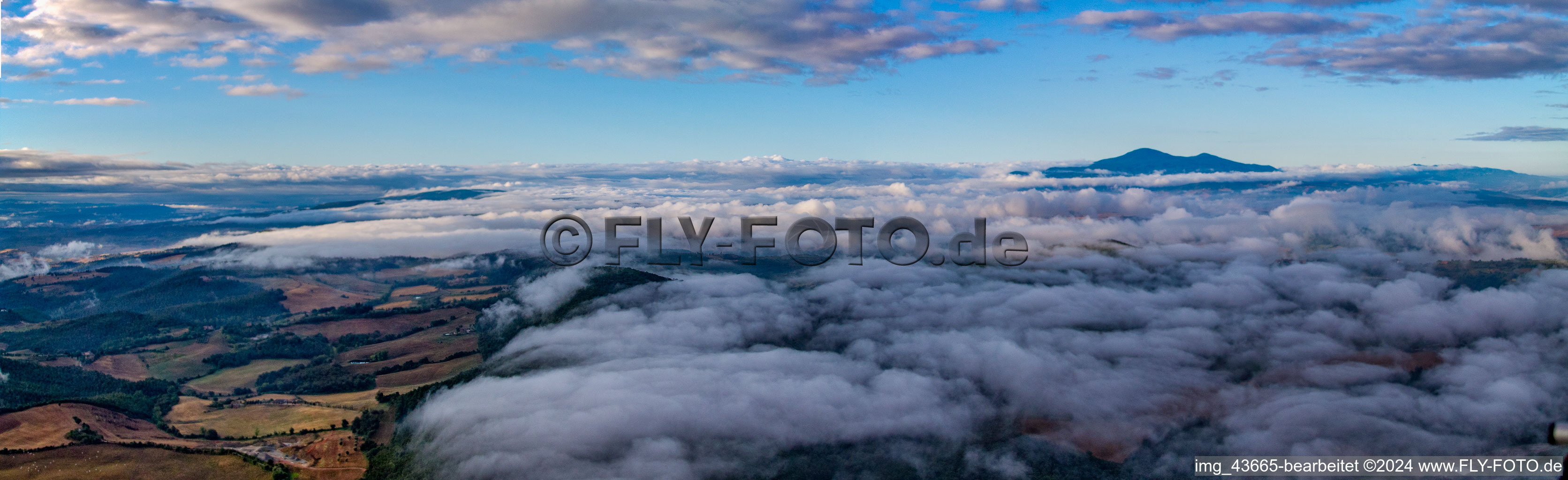 Sunrise over the clouds and countryside in Montepulciano in Toscana, Italy