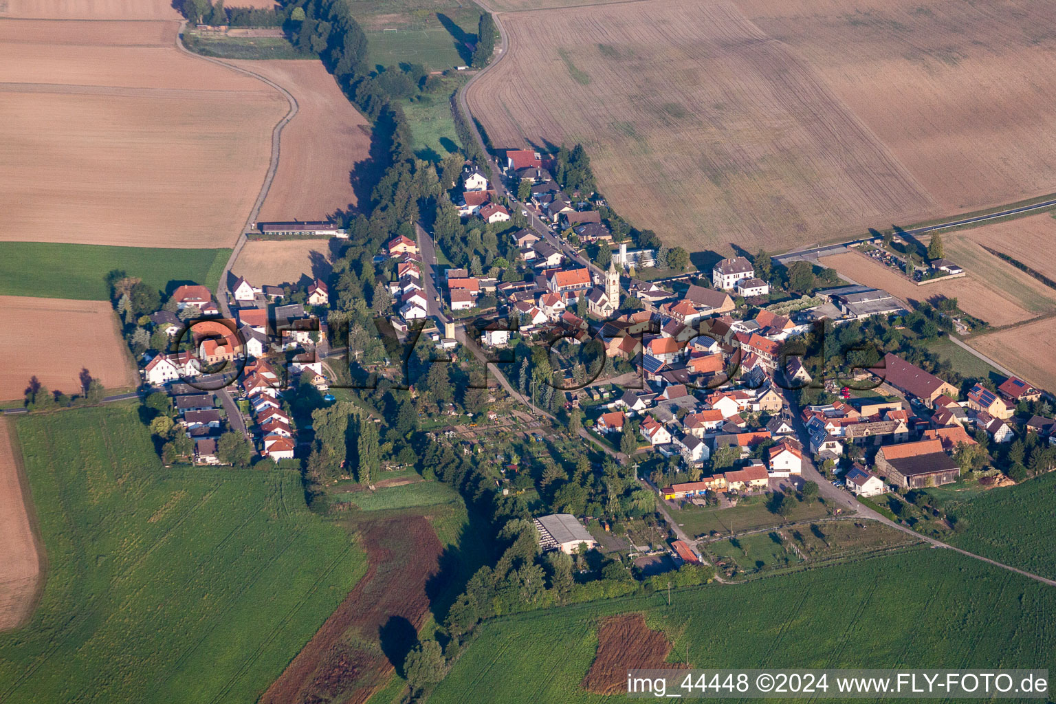 Village - view on the edge of agricultural fields and farmland in Mertesheim in the state Rhineland-Palatinate, Germany