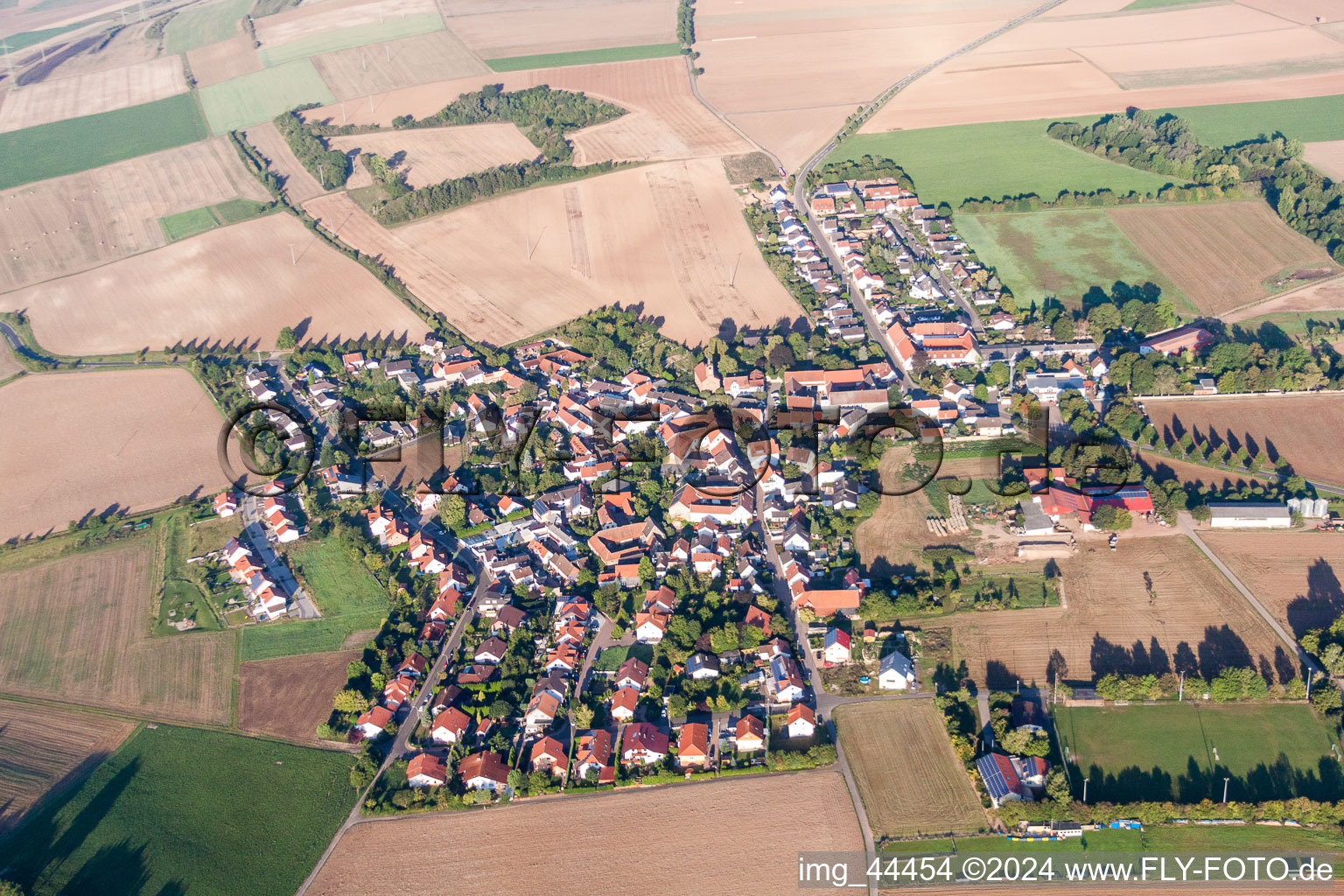 Aerial photograpy of Village - view on the edge of agricultural fields and farmland in Lautersheim in the state Rhineland-Palatinate, Germany