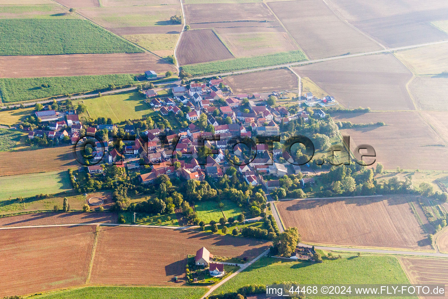 Village - view on the edge of agricultural fields and farmland in Rittersheim in the state Rhineland-Palatinate, Germany