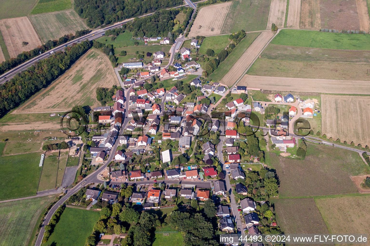 Village - view on the edge of agricultural fields and farmland in Roth in the state Rhineland-Palatinate, Germany