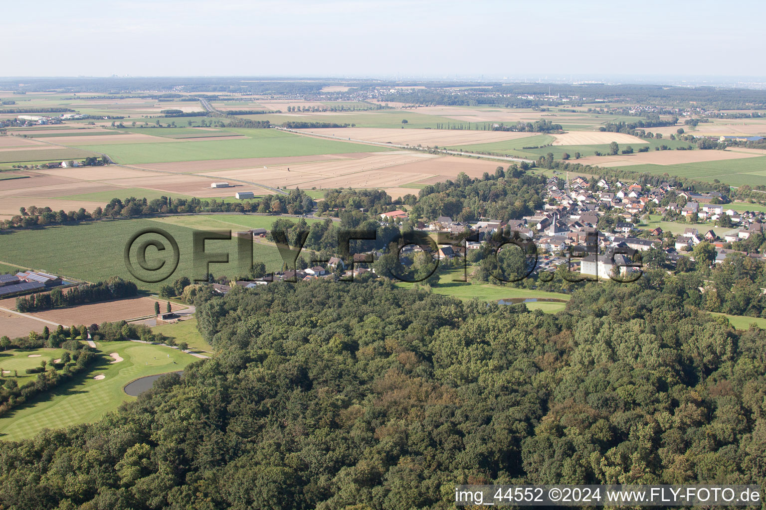Oblique view of Golf course in the forest at the castle Miel in Miel in the state North Rhine-Westphalia, Germany