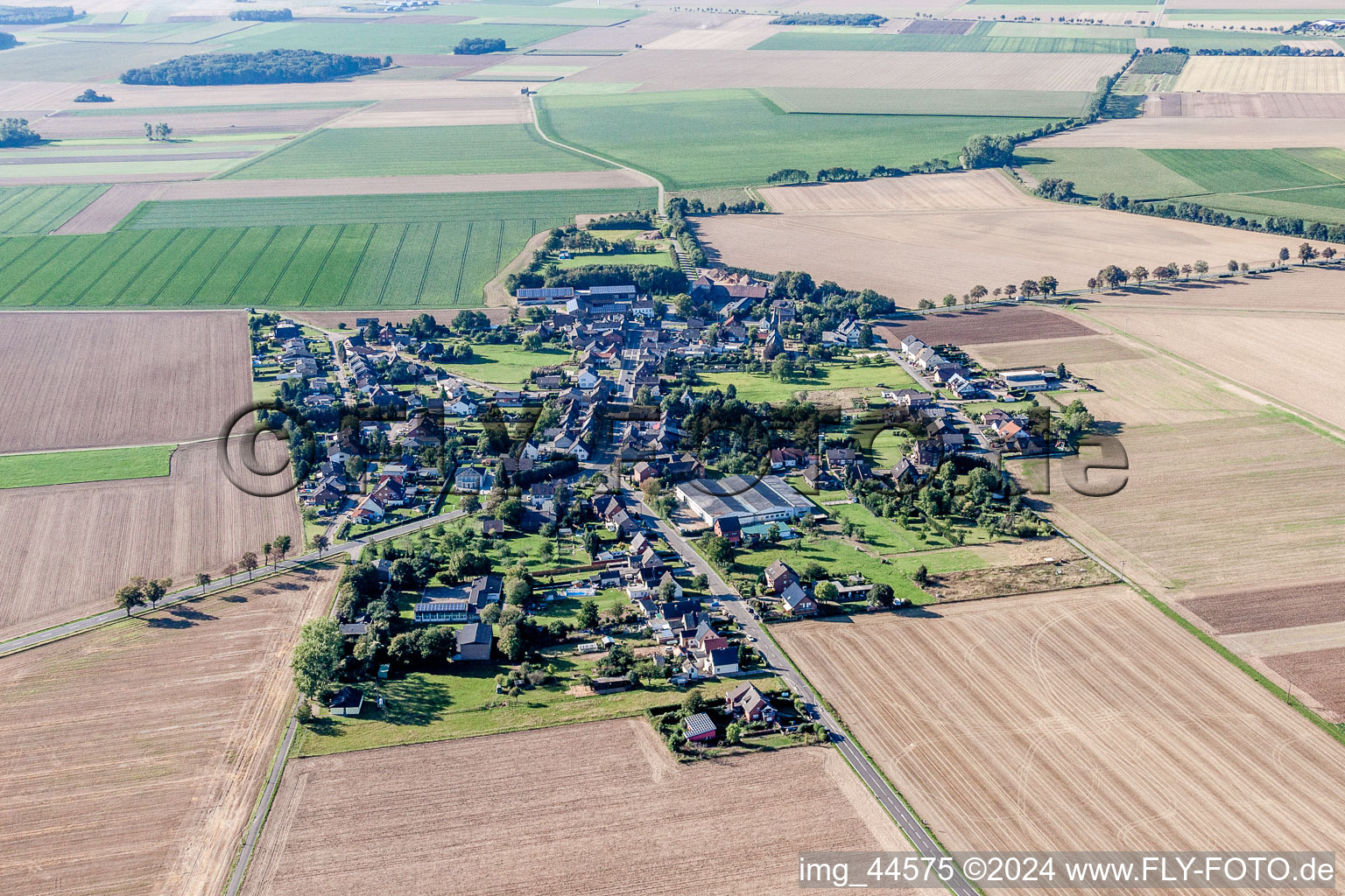 Village - view on the edge of agricultural fields and farmland in Weiler in der Ebene in the state North Rhine-Westphalia, Germany