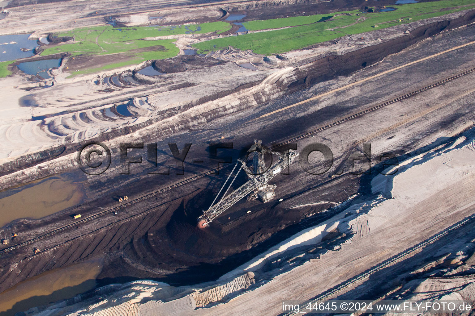 Dredging conveyor bridge in brown coal mine in Inden in the state North Rhine-Westphalia from the plane