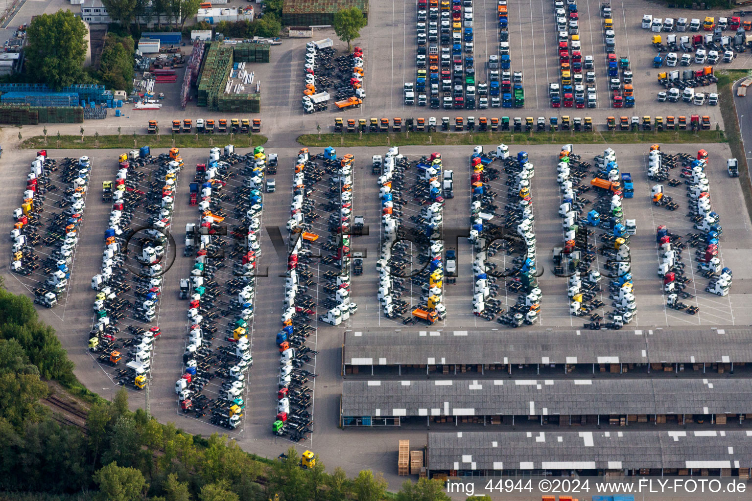 Aerial view of Parking place with new trucks on the premises of Daimler Automobilwerk Woerth in Woerth am Rhein in the state Rhineland-Palatinate, Germany