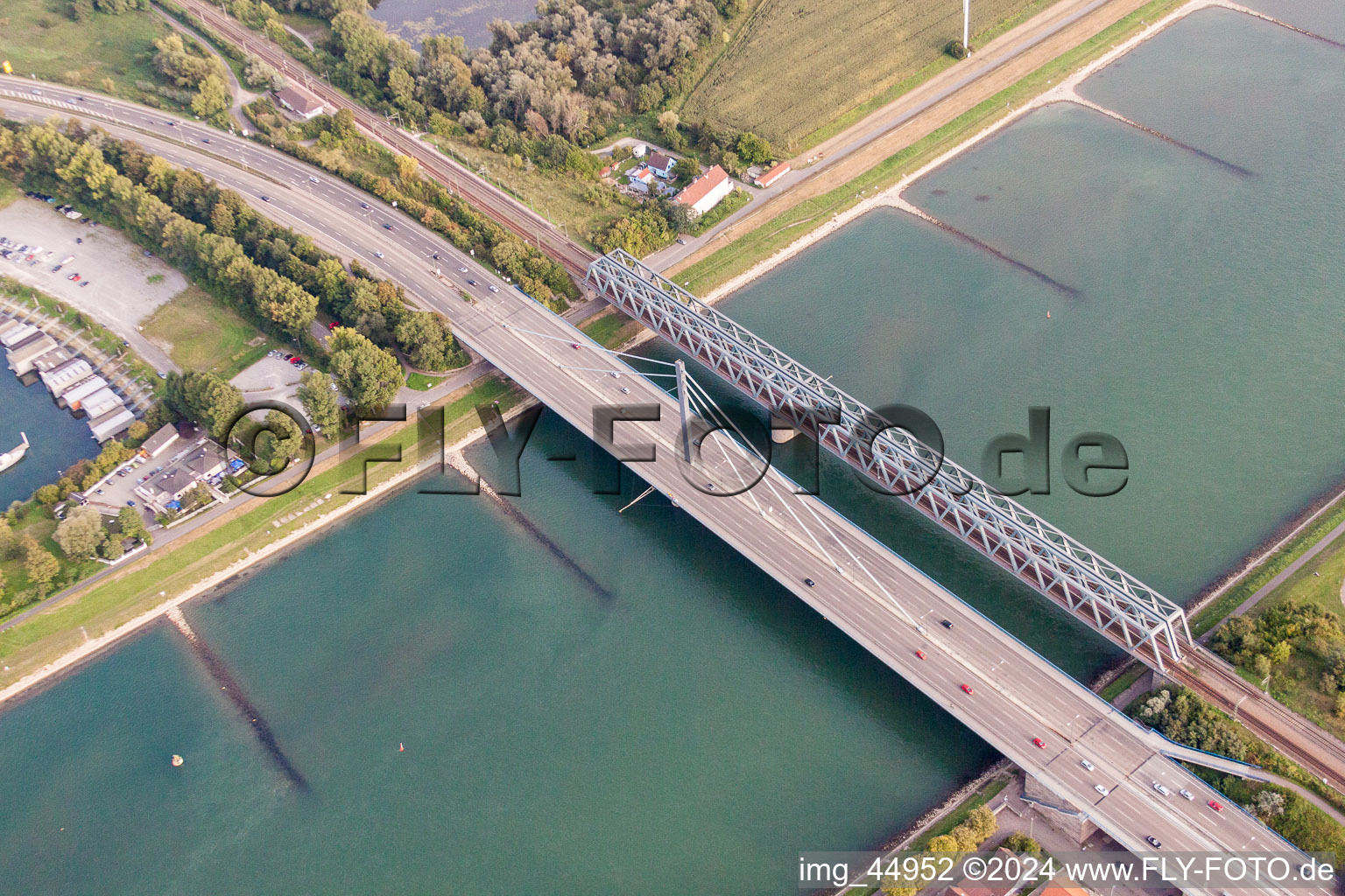 Rail and Street bridges construction across the Rhine river between Karlsruhe and Woerth am Rhein in the state Rhineland-Palatinate, Germany from above