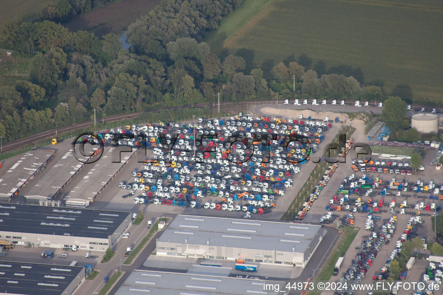 Oblique view of Daimler truck parking spaces in Wörth am Rhein in the state Rhineland-Palatinate, Germany