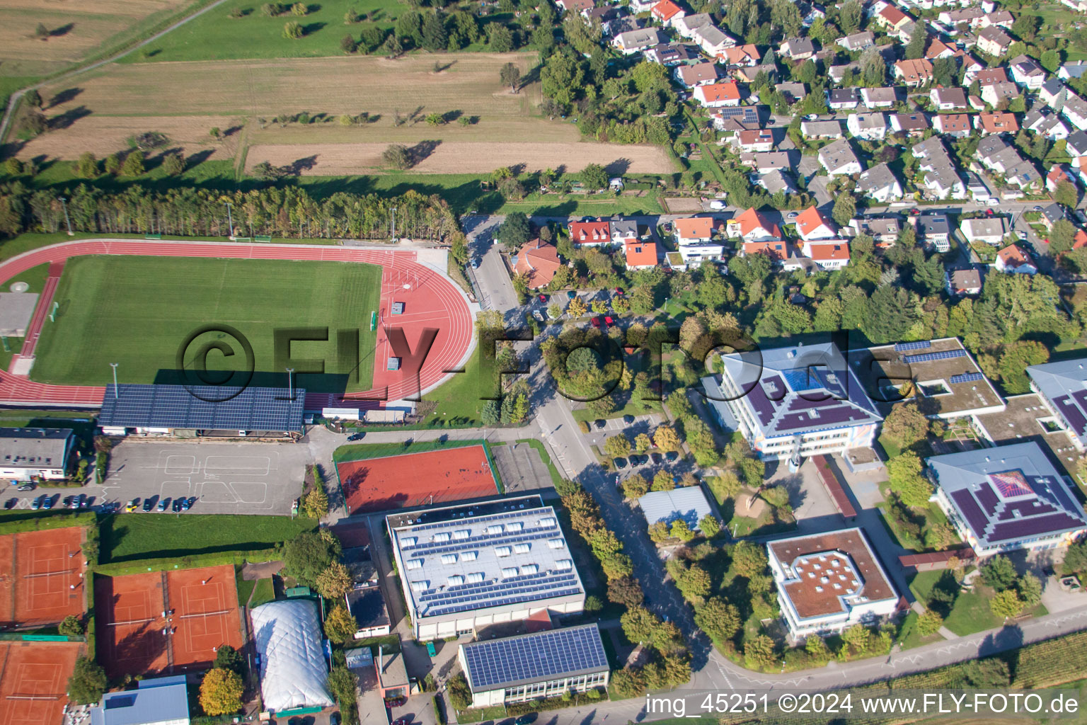 Ensemble of sports grounds of TC Langensteinbach and of Gymnasium Karlsbad in the district Langensteinbach in Karlsbad in the state Baden-Wurttemberg, Germany seen from above