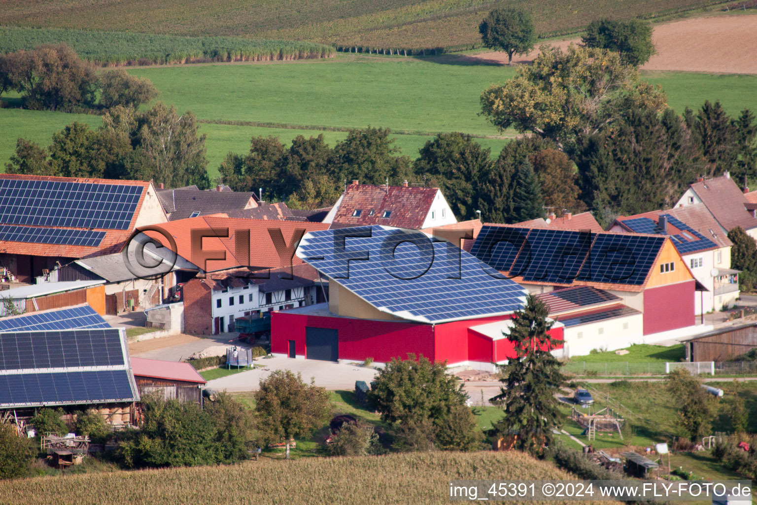Oblique view of Panel rows of photovoltaic turnable roof of a stable in the district Deutschhof in Kapellen-Drusweiler in the state Rhineland-Palatinate